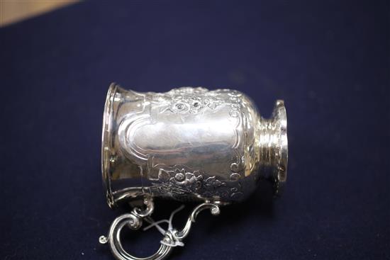 A Victorian silver christening mug embossed with a child and seated dog, 7 oz.